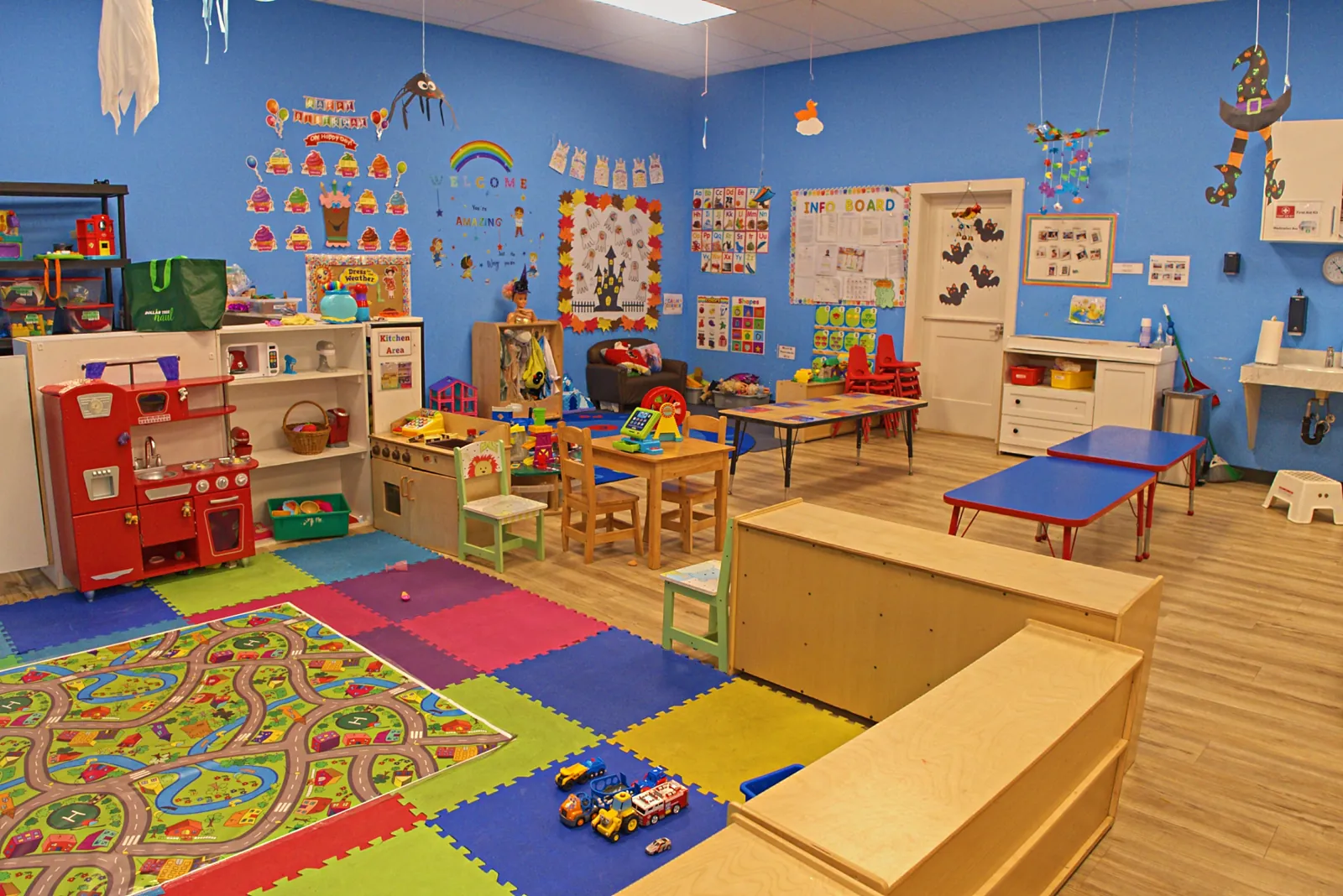 Soft foam floors, a play kitchen and a road rug built for busy little feet.