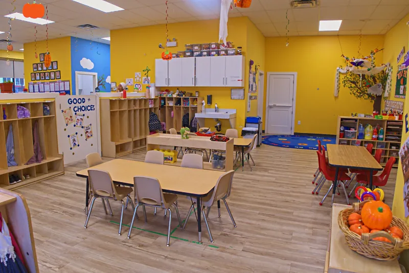 Classroom with a Good Choices board and small tables